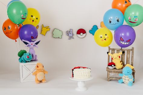 Pokemon Themed Cake Smash Pokemon Birthday Photoshoot, Pokemon Birthday Theme Ideas, First Birthday Pokemon Theme, Pokemon Smash Cake, Pokemon First Birthday, Pokemon Themed Cake, Pokemon Photoshoot, Pokemon Party Decorations, Themed Cake Smash