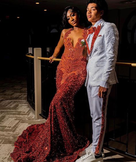 Black And Orange Prom Couple, Orange Tuxedo Prom, Rust Orange Prom Dress, Orange And Grey Prom Couple, Orange Prom Dresses Black Women, Orange Prom Suit, Orange Prom Couple, Burnt Orange Prom Dress, Baddie Prom Dresses