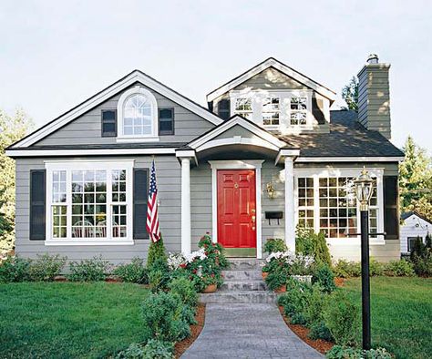 An all neutral facade gets a fun update with a bold red door. See more entryway makeovers: http://www.bhg.com/home-improvement/exteriors/curb-appeal/entryway-designs/?socsrc=bhgpin041613reddoor=2 Red Door House, Door House, Red Front Door, Black Shutters, Gray House, Grey House, Window Trim Exterior, Grey Houses, Entry Way Design