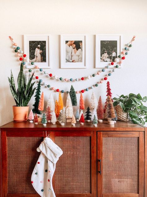 Bottle brush trees are trending this season—and we found the best ones on the market. Buy now, thank us later. Big Christmas Tree, Boho Christmas Decor, Christmas Decorations Apartment, Bohemian Christmas, Christmas Apartment, Brush Trees, Simple Christmas Decor, Christmas Inspo, Boho Christmas