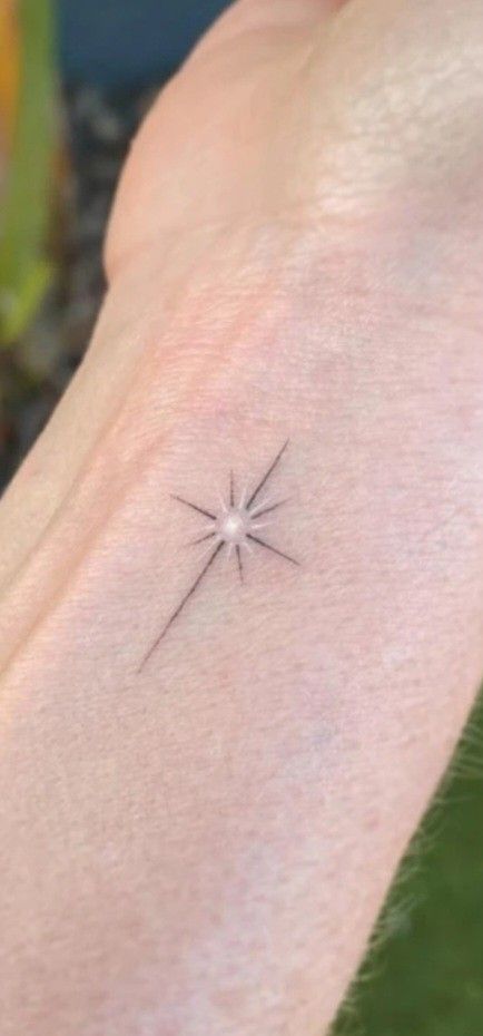 Small Star Burst Tattoo, Star With Name Tattoo, North Star Tattoo White Ink, Twinkling Stars Tattoo, Northstar Tattoo Design, Small North Star Tattoos, Realistic Star Tattoo, Long Star Tattoo, Bethlehem Star Tattoo