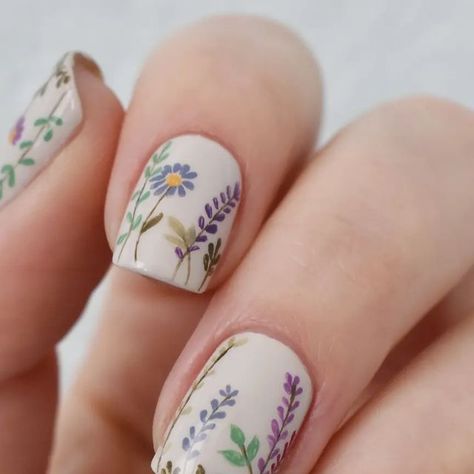 Nail Art by Amber on Instagram: "Spring Wildflowers 🌼 This design took two days to create and went through a few changes before this final look. I'm so happy with how it turned out. Wild and blooming with Spring. . . . Products Used: @zoyanailpolish 'Althea', 'Ireland', 'Ness', 'Honey', 'Austin', 'Mira', 'Tina', 'Shannon', 'Naked Manicure' Glossy top coat  . @ellamila 'Stonehearted' . 5mm nail art brush . . . . . #nails #nailart #naildesigns #springnails #nailstagram #flowernails #nailinstagram #floralnails #glossynails #nailgram #freehandnailart #amber_nailart" Happy Nail Ideas, Wildflower Nail Art, 50s Nails, Wild Flower Nails, Nature Nail Art, Wildflower Nails, Cheesy Lines, Garden Nails, Minimal Nails Art