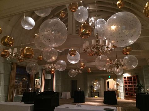 Clear large balloons with gold confetti and gold orbs - Magic In The Middle Wood Centerpieces Wedding, Hanging Balloons, Balloon Chandelier, Balloon Ceiling, Red Carpet Party, Clear Balloons, Prom Theme, Large Balloons, Diy Birthday Decorations