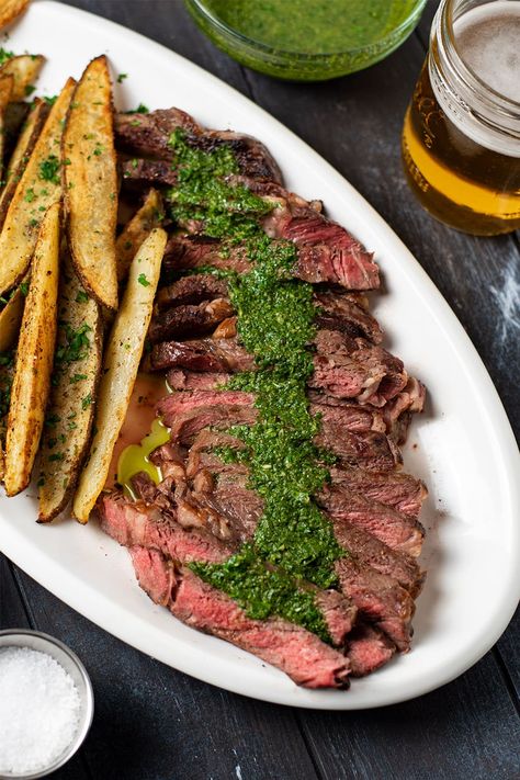 Steak frites recipe. Delicious pan-seared ribeye steak topped with homemade chimichurri sauce. Loaded with garlic, cilantro, and cumin, chimichurri will transform your sirloin steak into a Latin American dish and perfectly complement every bite. Served with crispy golden russet potato wedges seasoned with garlic powder, onion powder, paprika, salt, and pepper. It's the perfect blend of spices for fries. #steakfrites #steakandchimichurri #steak #chimichurri Steak And Fries Recipes, Steak Frites With Chimichurri, Russet Potato Wedges, Skirt Steak Chimichurri, Steak Frites Recipe, Chimichurri Recipe Steak, Sous Vide Recipes Beef, Steak And Chimichurri, Sous Vide Steak Recipe