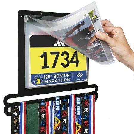 DISPLAYS YOUR ACHIEVEMENTS  Showcase your accomplishments and organize your accolades with our modern, space-saving medal & bib display rack! This one-of-a-kind award display also includes plastic sleeves for protecting and showcasing your race bibs.  10 PLASTIC SLEEVES  This rack can hang dozens of lanyard-style medals and is designed especially for lanyard ribbon medals. The rack includes hooks for holding up to 40+ lanyard-style medals. This product is tailored specifically for bibs given out Running Bib Display, Runner Medal Display, Bib Display, Hanging Medals, Race Medal Displays, Marathon Medal Display, Gymnastics Medals, Medal Hanger Display, Running Medal