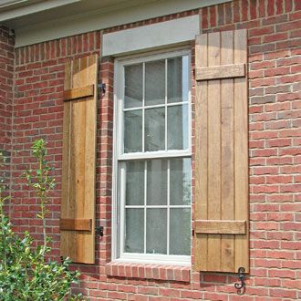 Wooden Stained Board and Batten Shutters on a Brick House Wood Shutters Exterior, Cedar Shutters, Custom Shutters, House Shutters, Diy Shutters, Board And Batten Shutters, Brick Ranch, Wooden Shutters, Red Brick House