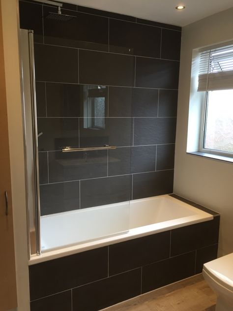 Black Tiled Bathroom Ideas, Tiled Bath Panel Ideas, Black Bath Panel Ideas, Black Tile Bathtub Surround, White Tub Black Tile Surround, Dark Tile Tub Surround, Bath Panel Ideas, Grey Bath Panel, Tiled Bath Panel