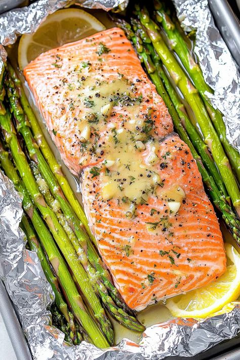 Discover the perfect weeknight dinner idea with this easy recipe for baked salmon and asparagus in foil. This dish is not only delicious but also quick to prepare, making it ideal for busy evenings when you want a healthy meal without all the fuss. The combination of tender salmon, flavorful asparagus, and zesty seasonings all cooked together in a foil packet creates a mouthwatering meal that will impress your family and friends. Salmon And Asparagus Baked In Foil, Salmon And Asparagus Baked, Foil Packet Salmon, Salmon And Asparagus In Foil, Frozen Salmon Recipe, Salmon Asparagus Foil, Baked Salmon And Asparagus, Oven Salmon, Salmon Asparagus