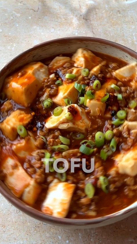 Mapo Tofu: a Szechuan staple that brings a fiery, numbing sensation to your taste buds. Silken tofu, often reserved for sauces and desserts, shines in this savory dish. It's a fantastic introduction to using silken tofu in a main course, delivering a satisfying 22 grams of protein per serving. Follow @veganpunks for more delicious plant-based creations. Tofu Packed Lunch, Tofu Vegetarian Recipes, Silky Tofu Recipes, Cold Tofu Recipes, Silken Tofu Dessert, Chinese Entrees, Shredded Tofu Recipe, Mapo Tofu Recipe Easy, Szechuan Tofu