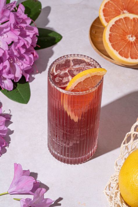 When summer rolls around, there’s nothing quite like sipping on a refreshing cocktail to beat the heat. And if you’re looking to try something new, we’ve got just the thing for you: a hibiscus paloma cocktail recipe that’s deliciously sweet and tangy. Plus, it’s easy to make, and you can even make it as a... Read More The post Hibiscus Paloma Cocktail appeared first on The Boozy Ginger. Paloma Drink, Hibiscus Syrup, Paloma Cocktail, Grapefruit Soda, Pop Fizz Clink, Refreshing Cocktail, Summer Rolls, Tequila Cocktails, Summer Barbecue