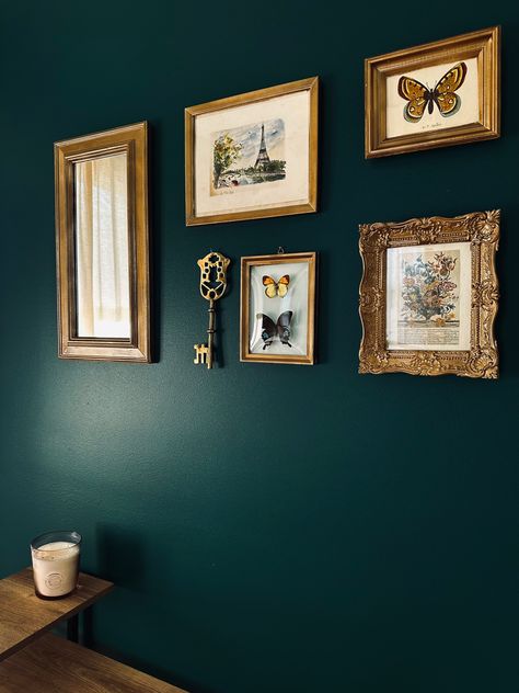 Emerald Green Gallery Wall, Gallery Wall Brass Frames, Dark Green Wall Gold Frames, Gold Frames On Green Wall, Brass Picture Frames Gallery Wall, Gallery Wall On Dark Green Wall, Eclectic Picture Frame Wall, Green And Gold Vintage Bedroom, Gold Photo Frames Wall