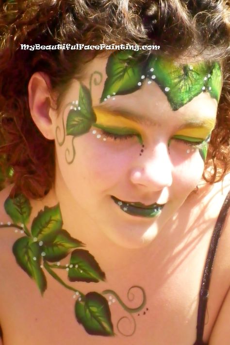 Poison Ivy face paint. Yellow background-Starblend powder. Leaves and lips-Tag small leaf split.  Outline-DFX black. White dots-DFX. Plant Face Paint, Poison Ivy Face Paint, Vine Face Paint, Ivy Face Paint, Leaves Face Paint, Leaf Face Paint, Leaf Makeup, Green Face Paint, Fairy Face Paint