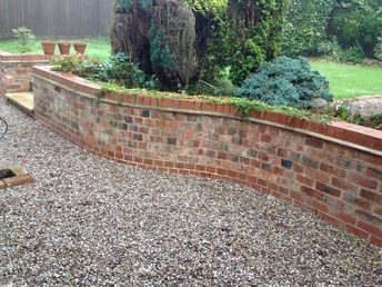 Garden Brick Wall, Backyard Walls, Brick Retaining Wall, Courtyard Oasis, Maria Burton, Retaining Wall Bricks, Brick Inspiration, Brick Wall Gardens, Wood Retaining Wall