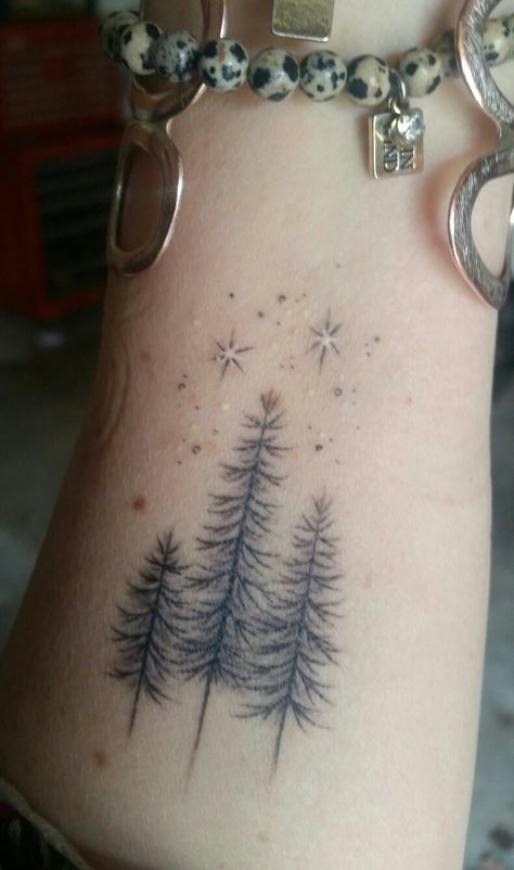 Pine Tree With Flowers Tattoo, Dainty Forest Tattoo, Outdoor Family Tattoo Ideas, Trees And Stars Tattoo, Delicate Tree Tattoos For Women, Winter Sleeve Tattoo, Winter Tattoo Ideas Nature, Winter Tattoos For Women, Tree And Stars Tattoo