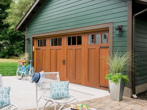 Garage + Courtyard Pictures From HGTV Urban Oasis 2016 >> http://www.hgtv.com/design/hgtv-urban-oasis/2016/garage-and-courtyard-pictures-from-hgtv-urban-oasis-2016-pictures?soc=pinterest Carriage Style Garage Doors, Green Garage, Green House Exterior, Garage Door House, Wooden Garage Doors, Garage Door Ideas, Garage Exterior, Green Exterior, Garage Door Makeover