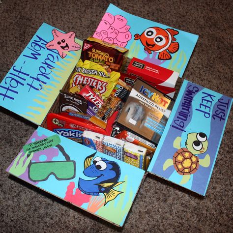 Deployment care packages! Finding Nemo Edition. I made this for my love to celebrate making it half way through our first deployment!! Army Boxes Care Packages, Disney Care Package, Disney Care Package Ideas, Deployment Box Ideas, Disney Announcement, Diy Movie Night Ideas, Soldier Care Packages, Deployment Care Package Ideas, Kino Box