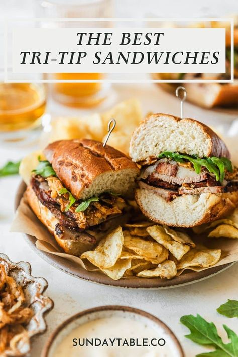 These tri-tip sandwiches have garlic aioli, fried onions, provolone, and arugula for an easy, gourmet sandwich! Use smoked or grilled tri-tip in this recipe, or use leftover steak to make things super easy. If you're not a fan of garlic sauce, try chimichurri or horseradish instead. These sandwiches are perfect for dinner and they're huge crowd-pleasers. They're one of my favorite meals for a crowd. Just whip them up and enjoy with sides like potato chips, pasta salad, potato salad, and more! Beef Tri Tip Recipes, Tritip Sandwich, Meals For A Crowd, Tri Tip Sandwich, Beef Tri Tip, Salad Potato, Aioli Sauce, Leftover Steak, Burger Dogs