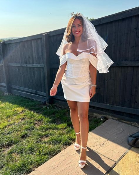 CORONATION Street and Strictly star Georgia May Footage wowed in a tiny wedding mini dress on her hen do. The star took to Instagram where she shared a stunning snap of her on her special day. Georgia donned a short corset style off the shoulder white dress with a veil and a headband that said […] Wedding Mini Dress, Off The Shoulder White Dress, Georgia May Foote, Bright Red Lipstick, Tiny Wedding, Georgia May, Black Two Piece, Coronation Street, Hen Do