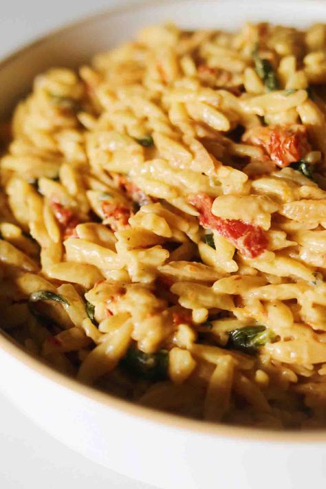 Sun Dried Tomato Orzo - Grilled Cheese Social Sun Dried Tomato Orzo, Cheesy Orzo, Tomato Orzo, Feta Pasta Salad, Creamy Pesto Pasta, Orzo Salad Recipes, Creamy Goat Cheese, Orzo Recipes, Italian Pasta Dishes