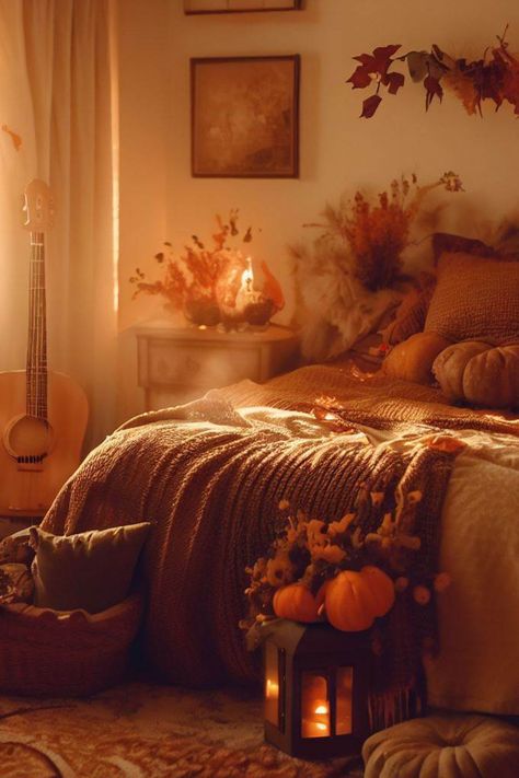 Step into a bedroom suffused in a soft, amber lamp glow, casting pockets of cozy light. The walls feature autumnal touches – a tapestry of golds and oranges graces them, while fairy lights twinkle around the headboard, infusing whimsy. A plaid throw blanket, like a pumpkin patch find, drapes over the bed, inviting comfort. This room is a serene sanctuary, where fall's spirit embraces every nook. Pumpkin Bedroom Decor, Fall Asthetic Decorations, Fall Bedroom Ideas Autumn, Autumn Cozy Room, Fall Theme Room, Fall Bedroom Ideas Cozy, Pumpkin Bedroom, Fall Bedding Bedrooms, Autumn Bedroom Aesthetic