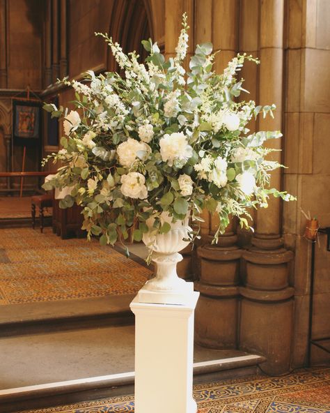 Large Flower Arrangements For Church Pedestal, Flower Display Wedding, Foliage Centerpiece Wedding, Pedestal Wedding Flowers, Large Urn Floral Arrangements, Church Florals Wedding, Wedding Flower Urns, Alter Flower Arrangements Wedding, White Delphinium Wedding