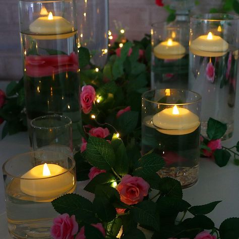 Floating tea lights Floating Tea Lights, Floating Led Candles, Swan Photography, Three Roses, Vase Centerpiece, Round Candles, Gallery Lighting, Floating Lights, Rose Stem