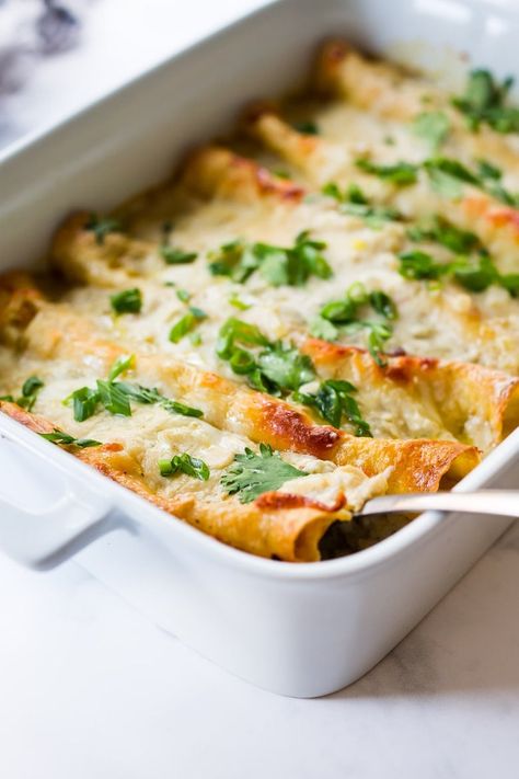 White Chicken Enchiladas with Creamy Poblano Sauce- an easy, delicious comfort food meal. These creamy chicken enchiladas will not disappoint! #whitechickenenchiladas #chickenenchiladas #creamychickenenchiladas #enchiladas #comfortfood Poblano Enchiladas, Poblano Sauce, Feasting At Home, Roasted Poblano Peppers, Enchilada Ingredients, Roasted Poblano, Vegetarian Enchiladas, White Chicken Enchiladas, Creamy Chicken Enchiladas