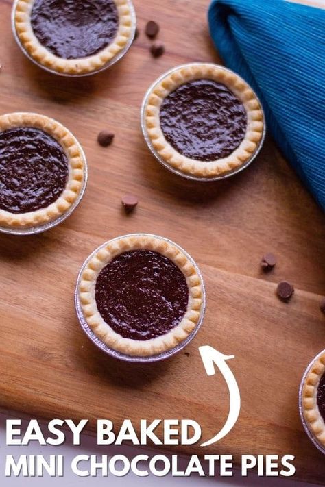 Mini Chocolate Pies are a baked chocolate pie that is in a buttery crust. The perfect homemade pie recipe to serve up for any occasion. Grab your mini pie crusts and make a homemade chocolate pie filling to pour in and bake. #party #food #dessert #homemade #chocolate #pie #baked #mini #singleserve #holiday #pierecipe Chocolate Pie Baked, Mini Fudge Pies, Recipes With Mini Pie Crust, Recipes Using Mini Pie Shells, Mini Chocolate Chess Pies, Chocolate Mini Pies, Mini Pie Crust Recipe Easy, Mini Chocolate Pies In Muffin Tin, Mini Pie Crust Desserts