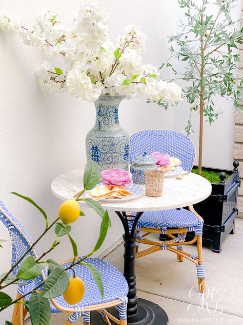 Parisian Patio Decor, White Hydrangea Wreath, Marble Bistro Table, French Bistro Chairs, Paris Bistro, Porch Outdoor, Front Courtyard, Faux Floral Arrangement, Decor Entryway