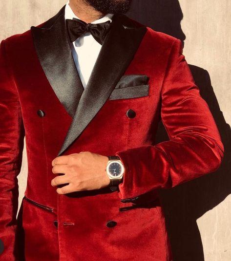 This red velvet tuxedo jacket offers a prestigious look for your groom attire. It is a wonderful mens outfit for those with a red and black wedding theme color schemes. If you want this red tux made custom for you, book an appointment with us at Giorgenti! #weddingoutfit #wedding #groomsuit #groomtuxedo Red And Black Tuxedo Men, Groom Red Suit Wedding, Black And Red Tuxedo Wedding Groom Suits, Black And Red Suit For Men Wedding, White And Red Groom Suit, Red And Gold Groomsmen Attire, Red Velvet Tuxedo Men, Red Velvet Groom Suit, Groomsmen Attire Black And Red