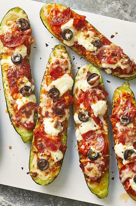 Turkey pepperoni, olives and diced tomato fill these stuffed zucchini boats. Ricotta and melted mozzarella cheese make this a fun twist on pizza without all the carbs. #dinner #dinnerideas #supperideas #dinnerrecipes #healthydinnerideas #healthydinnerrecipes #healthyrecipes Zucchini Pizza Boats, Optavia Hacks, Pizza Boats, Zucchini Pizza, Zucchini Casserole, Turkey Pepperoni, Zucchini Pizzas, Stuffed Zucchini, Healthy Zucchini