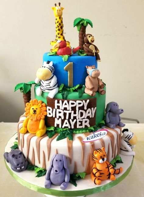 Jungle theme 3 tier birthday cake from Irresistible Cakes.  Believe us, all animal figurines are edible! Do you like it or not? Comment please. #jungletheme #junglethemecake #birthday #Birthdaycake 3 Tier Birthday Cake, Jungle Theme Cake, Cake 3 Tier, Tier Birthday Cake, Jungle Birthday Cakes, Jungle Theme Cakes, Cake Structure, Tiered Cakes Birthday, Jungle Baby Shower Theme