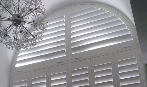 Arched window shutters – customer case study | The Shutter Store USA Shutters On Arched Windows, Arch Window Shutters, Arch Window Covering Ideas, Arched Window Shutters, Blinds For Arched Windows, Gray Livingroom, Half Circle Window, Arched Window Coverings, Diy Window Shades