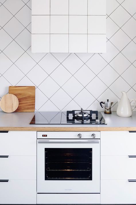 How To Design For The Compact Kitchen | square white tiles placed on the diagonal Kitchen Furniture Design Space Saving, Kitchen No Upper Cabinets, Square Tile Backsplash, Compact Kitchen Appliances, Murphy Bed Ikea, Plumbing Pipe Furniture, Style On A Budget, White Kitchen Backsplash, Murphy Bed Plans