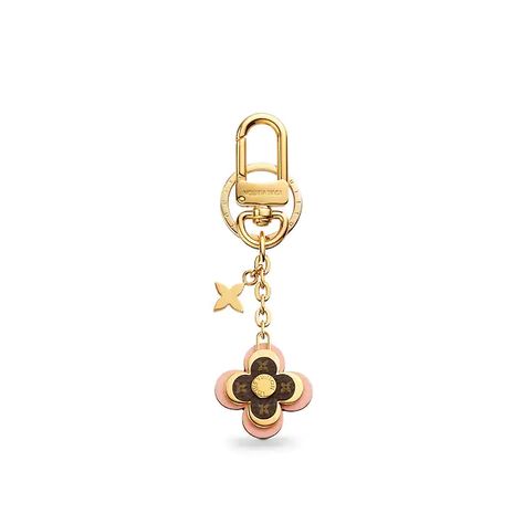 Women's Luxury Key Holders, Charms & More - Louis Vuitton ® Logo Luxe, Louis Vuitton Luggage, Louis Vuitton Official Website, Key Holders, Louis Vuitton Accessories, Purse Charms, Blooming Flowers, Vuitton Bag, Flower Charm