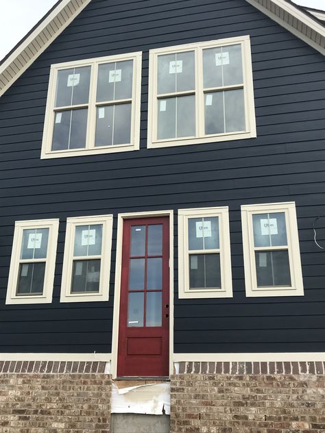 Brigand navy paint and CrabbyApple Sherwin Williams red door Navy House Red Door, Blue Gray Exterior House Colors Red Door, Blue House Red Trim, Navy House Black Door, Blue Siding Red Door, Red Door Blue House, Dark Blue House Red Door, Black House Red Door, Blue House With Red Door