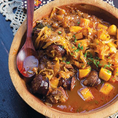 Bigos (Polish Pork and Sauerkraut Stew) | My mom, like many women in Poland, made bigos—a stew of pork shoulder, bacon, kielbasa, and sauerkraut—for every celebration. Now my sister, makes massive quantities, then freezes it. When people come to visit her, she heats it up and tells them, "Look, I made bigos just for you!" —Halina Pinas, Saveur accountant. | From: saveur.com Bigos Recipe, Pork And Sauerkraut, Hunters Stew, Boneless Pork Shoulder, Kielbasa, Pork Shoulder, European Food, Polish Recipes, Russian Recipes