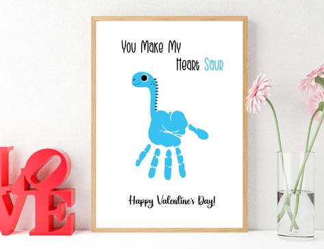 Valentine's Day You Make My Heart Saur Dinosaur Handprint Art This is a fun activity for kids to celebrate Valentine's Day.  Just add paint to create this cute keepsake of your child's handprints.  This is great for a keepsake for parents, or to send as Valentines to friends and family.  This would also be a great activity for a classroom.  Perfect DIY Valentines! *This is a digital download, which means you will receive a PDF instantly with your purchase.  The PDF can be printed on your home pr Dino Valentines Craft, Valentines Card For Dad From Kids, Handprint Valentines Crafts For Kids, Dino Handprint, Valentines Handprint Art, Handprint Dinosaur, Dinosaur Handprint Art, Valentines Day Handprint Art, Valentine Handprint Art