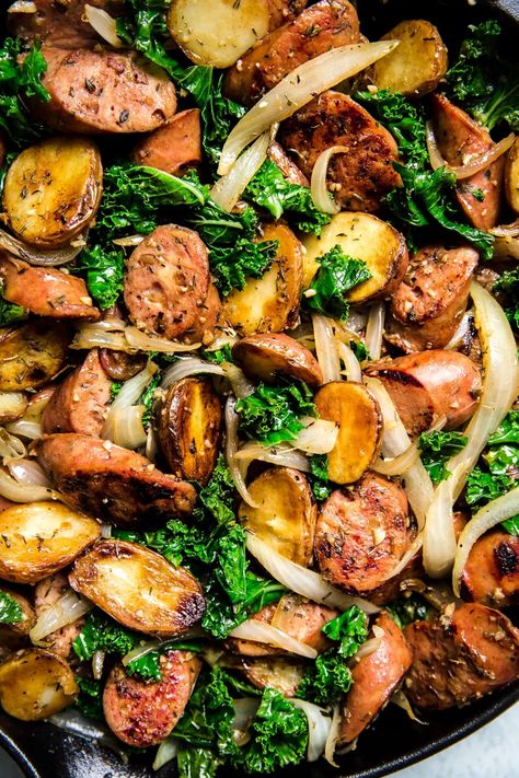 This recipe ticks all the boxes—a little meaty, some dark leafy greens, and some starchy goodness. An easy one-pan sausage, kale and potato skillet that pleases everyone, from cook to clean-up crew. Chicken Kale Sausage Recipes, Kale Potatoes And Sausage, Kale Lunch Recipes, Kielbasa And Kale Recipes, Recipes Using Kale Dinners, Kale Potato Recipes, Pork And Kale Recipes, Dark Green Vegetables Recipes, Dinner With Kale