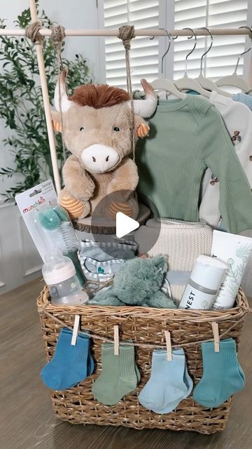 Kellie Atkinson on Instagram: "Baby shower gift basket 🧸🍼 🧺  Comment “Baby” for links sent to you inbox 💙🔗  #asmr #baby #babyshower #babyboy #babyshowergift #babyshowergiftideas #giftbasket" Baby Basket With Hanging Clothes, Baby Clothing Rack Gift Basket, Baby Shower Gifts Boy Basket, Girl Baby Shower Basket Ideas, Baby Gift Basket With Hanging Clothes, Baby Book Gift Basket, Baby Gift Basket Ideas For Boys, Gift Basket Ideas For Baby Shower Prizes