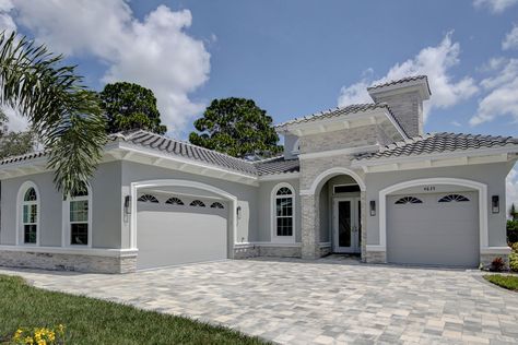 Exterior Gallery | Homes by Southern Image Florida Homes Exterior, Stucco House Colors, Stucco And Stone Exterior, Grey Exterior House Colors, Stucco Colors, Mediterranean Homes Exterior, Gray House Exterior, Exterior House Paint Color Combinations, Classic House Exterior