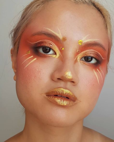 carolyn on Instagram: “🍂firebird🍂 . i tried guys, i really did LOL. I'm not really satisfied with this look (it was supposed to be a phoenix) as it didn't turn…” Gold Face Paint Designs, Phoenix Makeup Look, Orange And Gold Makeup, Sunshine Makeup, Gold Halloween Makeup, Fire Element Makeup, Sun Inspired Makeup, Sun Makeup Looks, Fire Inspired Makeup