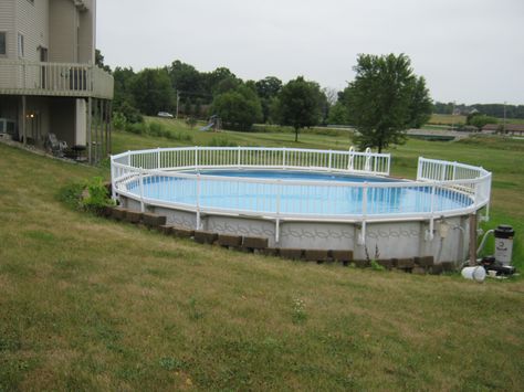 retaining wall around above ground pool | Columbia City house now connected to pool with new decks Pool And Deck Ideas, Pool Retaining Wall, Pool Deck Ideas Inground, Above Ground Pool Inground, Pool Plans, Pool Deck Plans, Pool Design Ideas, Swimming Pool Decks, Outside Pool