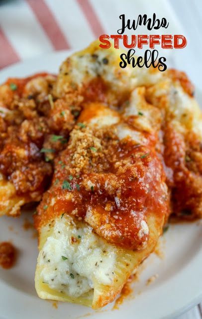 Olive Garden introduced new jumbo features and one was the Jumbo Stuffed Shells. They're stuffed with four cheeses and then topped with marinara and alfredo sauce. And they are delicious!!! But you don't have to go to Olive Garden to get them - you can have them in your own home! #olivegarden #copycatrecipes #stuffedshells Stuff Noodles Shells, Stuffed Shells With Cream Cheese Recipe, Giant Stuffed Shells Recipe, Meat Sauce Stuffed Shells, Spaghetti Stuffed Shells, Jumbo Shells Recipe Beef, Stuff Jumbo Shells, Stuffed Jumbo Pasta Shells Cream Cheese, 3 Cheese Stuffed Shells