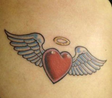 Angel wings heart tattoo Traditional Heart With Wings Tattoo, Pink Angel Wings Tattoo, Heart With Wings And Halo Tattoo, Winged Heart Tattoo, Heart With Halo Tattoo, Heart Angel Wings Tattoo, Heart Shaped Angel Wing Tattoo, Heart With Angel Wings Tattoo, Heart Wings Tattoo