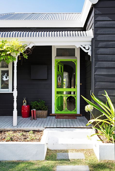 Is your front door in need of a quick facelift? A bold paint colour will give your home exterior a quick and inexpensive refresh. Read on for some fabulous front door colour ideas and inspiration. Dark Home Exterior, Dulux Exterior Paint, Weatherboard Exterior, Exterior House Renovation, Weatherboard House, House Colours, Front Porch Ideas Australia, Cottage Renovation, Pintura Exterior