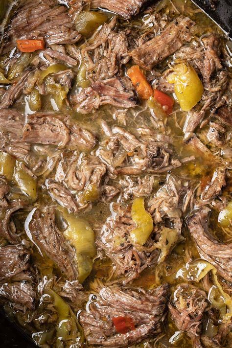 close up top view of shredded italian beef with pepeprs in crockpot Italian Beef With Pepperoncini, Italian Beef Tips Crockpot, Italian Beef Crock Pot Recipes, Italian Drip Beef Pioneer Woman, Rump Roast Italian Beef, Italian Beef Dutch Oven, Italian Beef In Instapot, Beef Stew With Pepperoncini, Venison Italian Beef