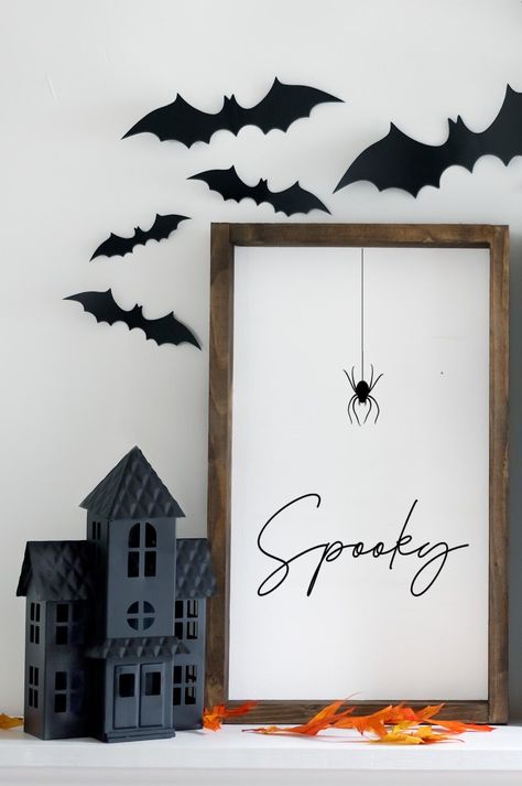 Spooky Wood Sign This is the perfect Halloween sign for those looking for a minimalist or chic vibe. This would look amazing layered on a mantel with one of our textured pieces, or your own personal fave Halloween Decor. This simply spooky beauty is 12" w x 16" h and available in 6 different paint colors as well as 6 different stains for your frame.  THIS SIGN IS DISTRESSED AND THIS WILL VARY ON EACH SIGN DUE TO THE HANDMADE NATURE.  *Please note, this listing is only for the sign only. All other items shown in the images are not included unless otherwise specified. Each listing is for one product (unless otherwise specified), in the size and design specified in each individual listing. We hand make each item listed in our shop; therefore there may be slight variations in your sign compare Spooky Cute Halloween Decor, Cute Halloween Office Decor, Halloween Ladder Decorations, Fall Cricut Decorations, Black And White Halloween Pictures, Trending Halloween Decor, Tasteful Halloween Decor, Subtle Halloween Decor, Halloween Sign Ideas