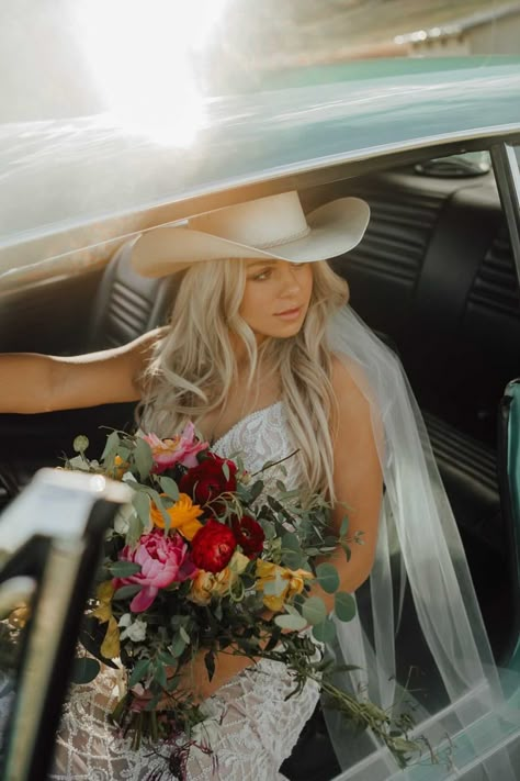 Stunning bride in cowgirl hat sitting in vintage car - Montana wedding inspiration - bride style Cowgirl Hat Wedding Dress, Wedding Cowgirl Hat For Bride, Cowboy Hat With Wedding Dress, Cowgirl Hat Veil, Bride With Cowboy Hat, Cowgirl Wedding Hat, Cowboy Beach Wedding, Wedding Hair With Cowboy Hat, Cowboy Hat Veil