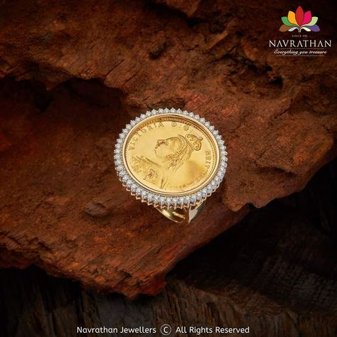 A regular gold coin ring is ornamented with diamonds. Its fine craftsmanship and the art of fine jewellery are reminiscent of a bygone era. It is specially created to suit and delight you. Walk into our stores and experience its pulse quickening design a treasure with thrilling craftsmanship and grab this Ginni Diamond Ring before it goes off the shelf or visit us at www.navrathan.com and get it immediately.  #Jewellery #Navrathan #Jewellers #Gold #Silver #Diamond #GoldNecklaceDesign #SilverArti Gini Ring In Gold, Ginni Jewellery Design, Ginni Set Designs, Gold Coin Pendant Designs, Ginni Ring Designs Gold, Ginni Pendant Design, Ginni Pendant Design Diamond, Coin Rings Women, Ginni Ring